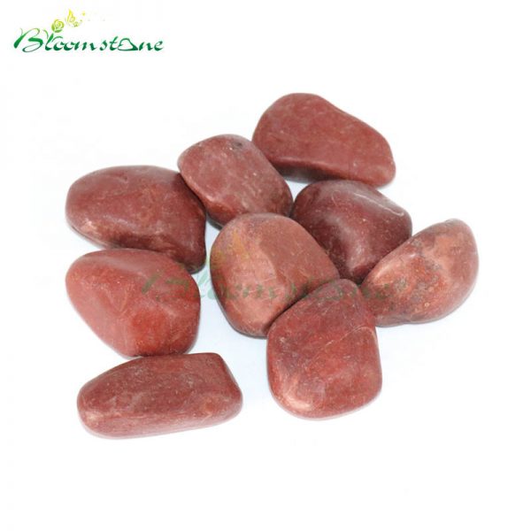A GRADE POLISHED RED GRANITE PEBBLE