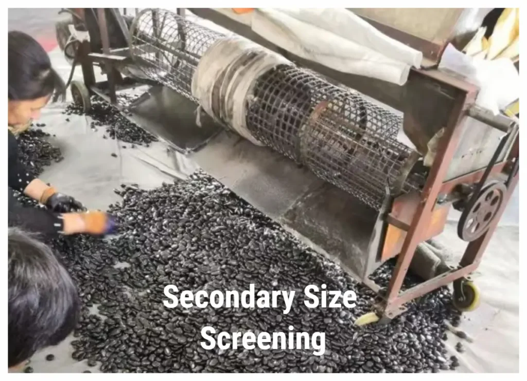 Secondary size screening process for high polished black pebbles, ensuring uniform sizing and high quality control at Changzhou Bloom Stone.