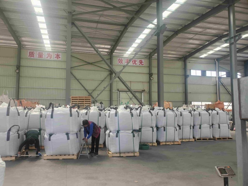 1 to 1.3 tons of landscaping pebble stones safely packed on heavy-duty fumigated solid wood pallets, secured for ocean freight.