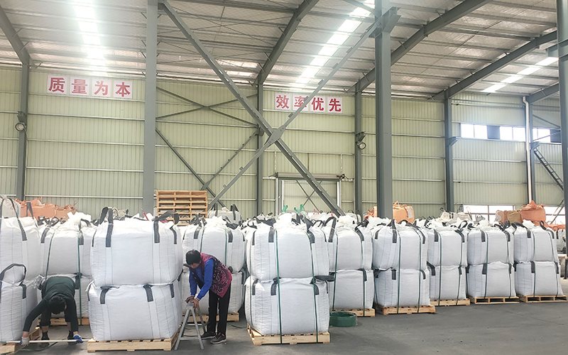 Jumbo bag packaging and warehouse storage for landscape pebbles and gravel
